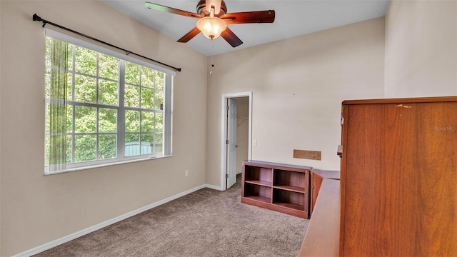 1455 Royal Forest Loop, Lakeland, FL 33811 - unfurnished bedroom with multiple windows, carpet flooring, ceiling fan, and a walk in closet
