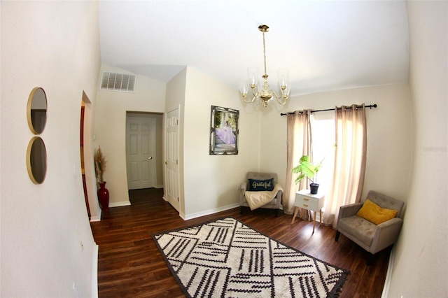 130 Winsor Ave, Davenport, FL 33837 - living area featuring a chandelier, wood finished floors, and vaulted ceiling