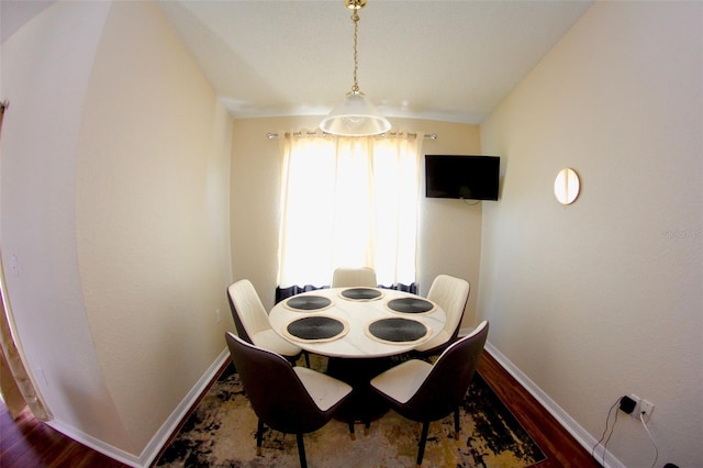 130 Winsor Ave, Davenport, FL 33837 - dining area with baseboards and wood finished floors