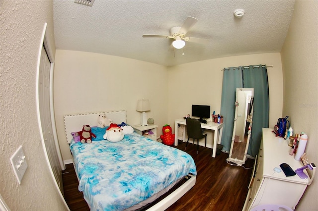 130 Winsor Ave, Davenport, FL 33837 - bedroom featuring wood finished floors, a textured ceiling, and ceiling fan