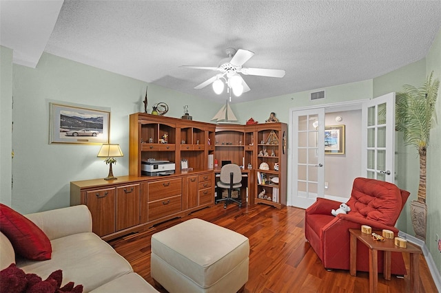 4 Oceans W Blvd Unit 502D, Daytona Beach Shores, FL 32118 - living area featuring dark wood-type flooring, a ceiling fan, a textured ceiling, french doors, and built in study area