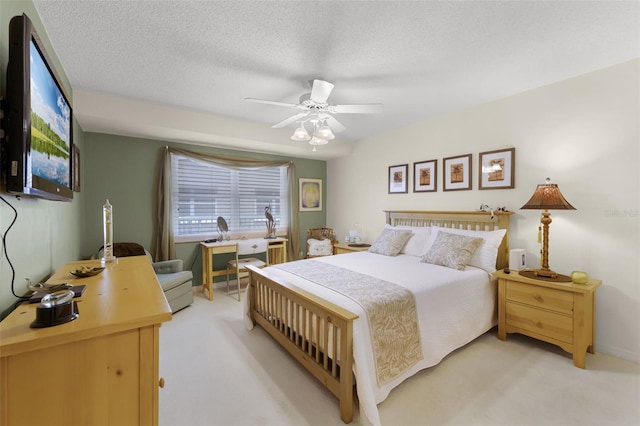 4 Oceans W Blvd Unit 502D, Daytona Beach Shores, FL 32118 - bedroom with light colored carpet, ceiling fan, and a textured ceiling