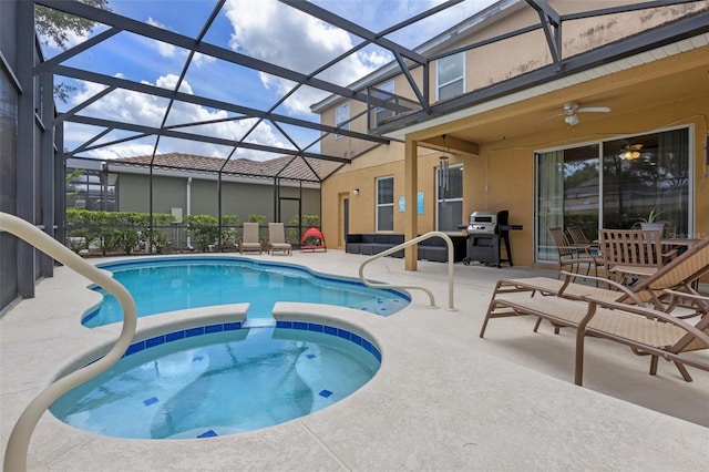 5172 Oakbourne Ave, Davenport, FL 33837 - view of swimming pool with a patio area, a grill, a pool with connected hot tub, a ceiling fan, and glass enclosure
