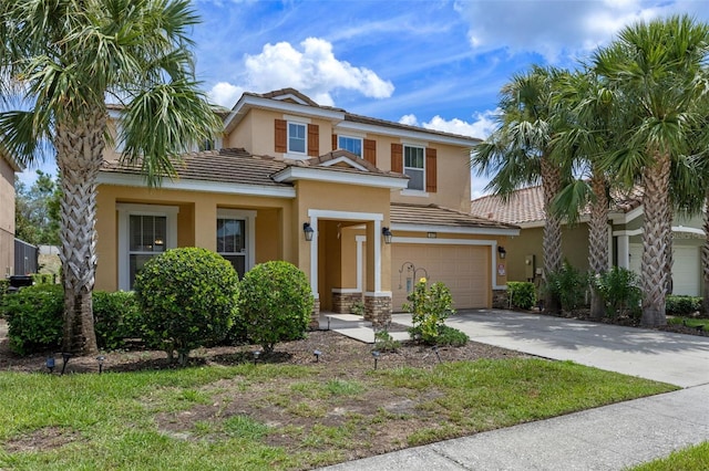 5172 Oakbourne Ave, Davenport, FL 33837 - view of front of property with a garage, stucco siding, driveway, and a tile roof