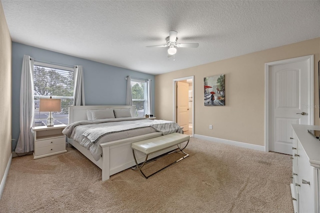 5172 Oakbourne Ave, Davenport, FL 33837 - bedroom with light colored carpet, a textured ceiling, a ceiling fan, and ensuite bath