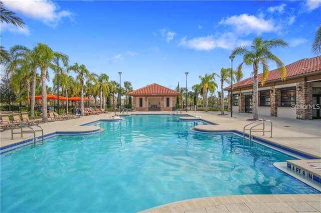 5172 Oakbourne Ave, Davenport, FL 33837 - community pool featuring a patio area