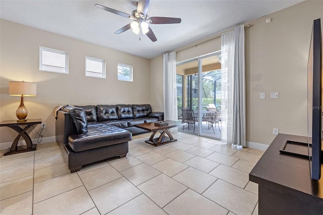 5172 Oakbourne Ave, Davenport, FL 33837 - living room featuring a ceiling fan and light tile patterned floors