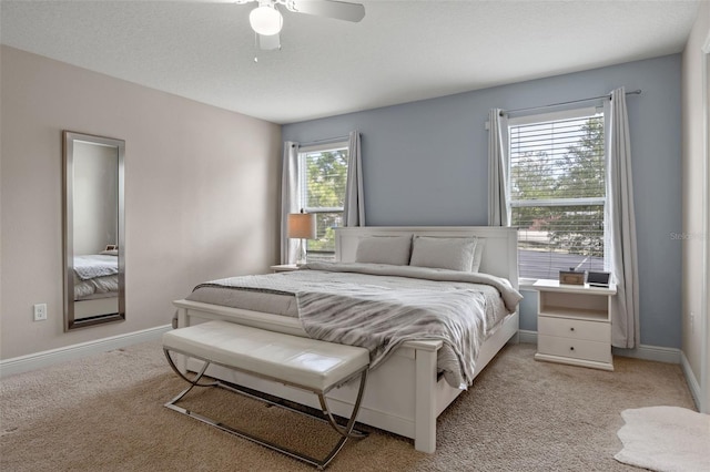 5172 Oakbourne Ave, Davenport, FL 33837 - bedroom featuring light carpet and ceiling fan