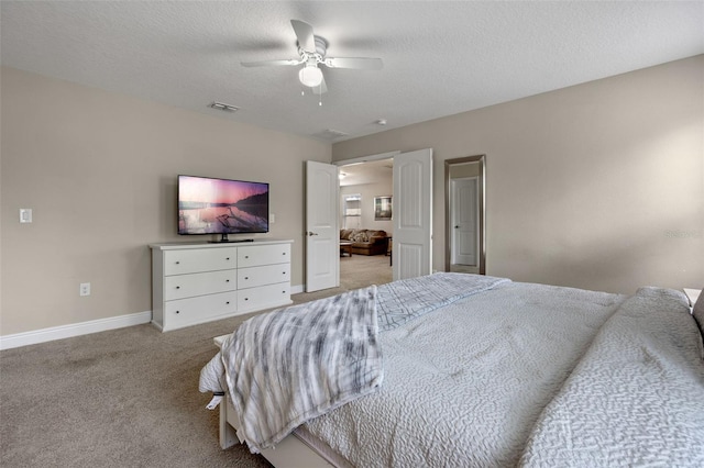 5172 Oakbourne Ave, Davenport, FL 33837 - bedroom featuring light colored carpet, ceiling fan, and a textured ceiling