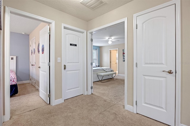 5172 Oakbourne Ave, Davenport, FL 33837 - hallway with carpet floors and a textured ceiling