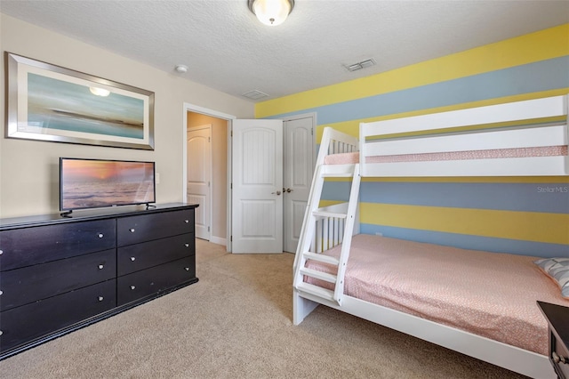 5172 Oakbourne Ave, Davenport, FL 33837 - bedroom featuring light carpet, a textured ceiling, and a closet