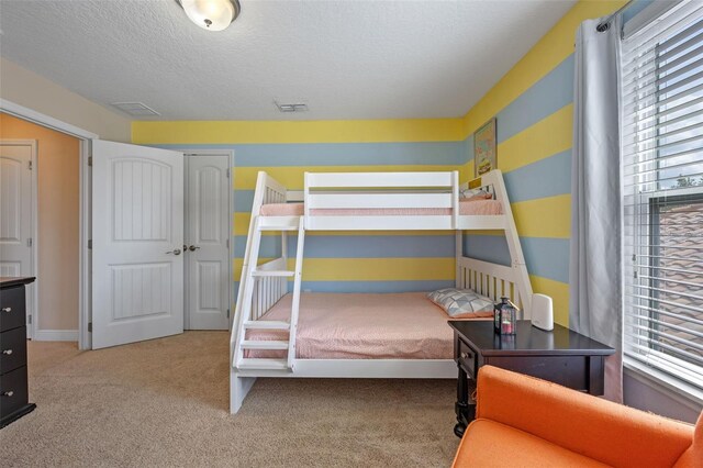 5172 Oakbourne Ave, Davenport, FL 33837 - carpeted bedroom featuring a textured ceiling