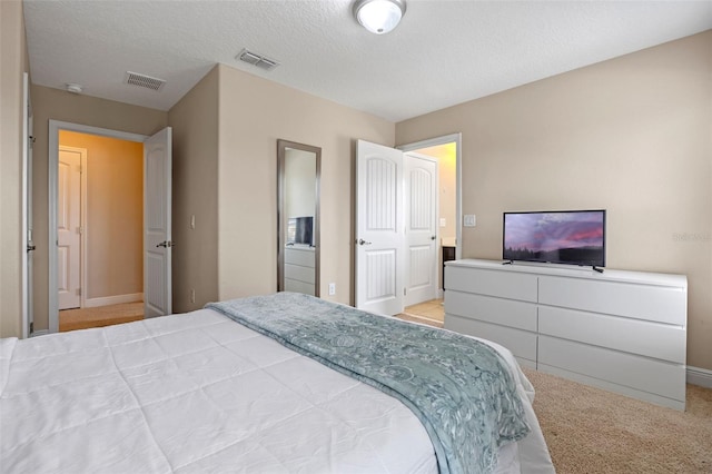 5172 Oakbourne Ave, Davenport, FL 33837 - carpeted bedroom with baseboards and a textured ceiling