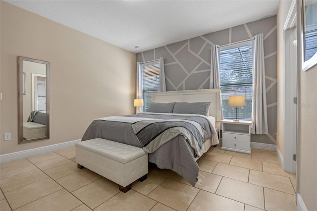 5172 Oakbourne Ave, Davenport, FL 33837 - bedroom featuring baseboards and light tile patterned floors