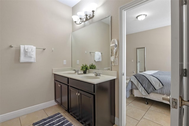 5172 Oakbourne Ave, Davenport, FL 33837 - bathroom featuring tile patterned floors, double vanity, and ensuite bath