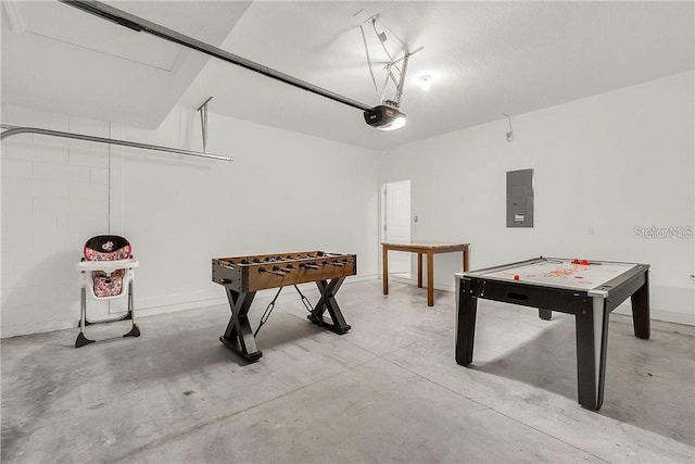 5172 Oakbourne Ave, Davenport, FL 33837 - recreation room with electric panel, concrete floors, and a garage