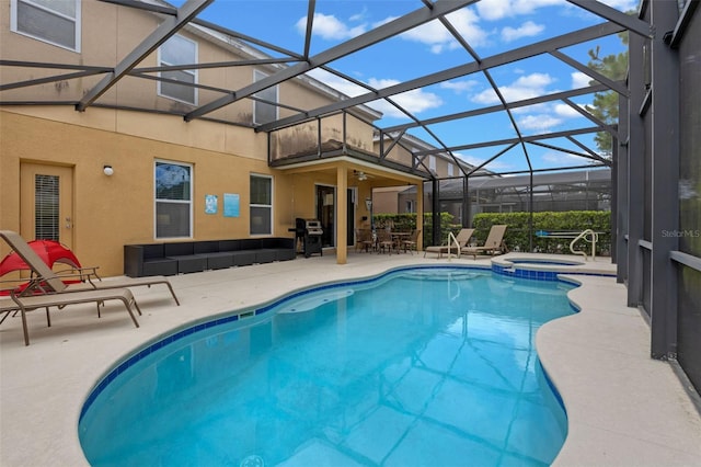 5172 Oakbourne Ave, Davenport, FL 33837 - view of pool with a patio area, a pool with connected hot tub, glass enclosure, an outdoor hangout area, and grilling area