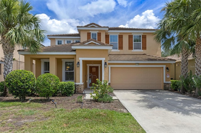 5172 Oakbourne Ave, Davenport, FL 33837 - view of front of property featuring an attached garage, stucco siding, driveway, and a tile roof
