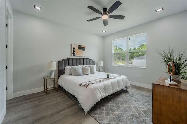 63 W 10th St, Apopka, FL 32703 - bedroom with wood finished floors and a ceiling fan