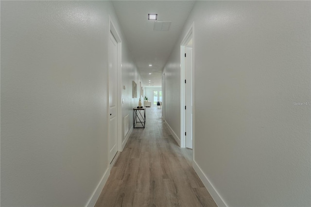 63 W 10th St, Apopka, FL 32703 - hall featuring light wood-style flooring and baseboards