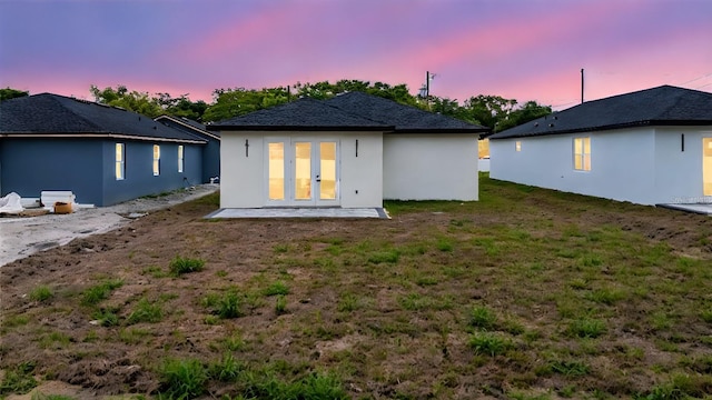 63 W 10th St, Apopka, FL 32703 - rear view of house featuring french doors, a yard, stucco siding, and a patio