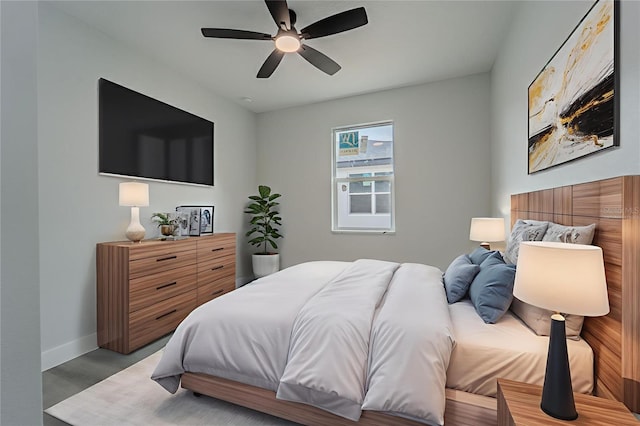 63 W 10th St, Apopka, FL 32703 - bedroom with wood finished floors and a ceiling fan