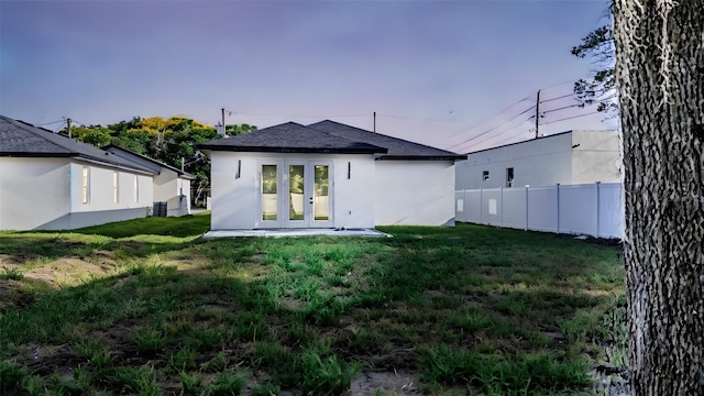 63 W 10th St, Apopka, FL 32703 - back of house with french doors and stucco siding