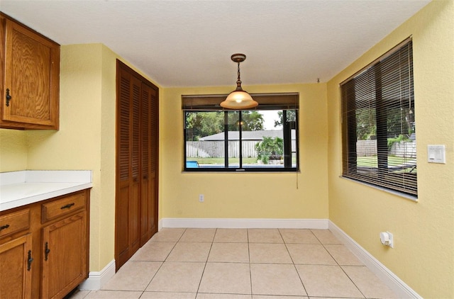 173 Tollgate Br, Longwood, FL 32750 - unfurnished dining area featuring light tile patterned flooring and baseboards
