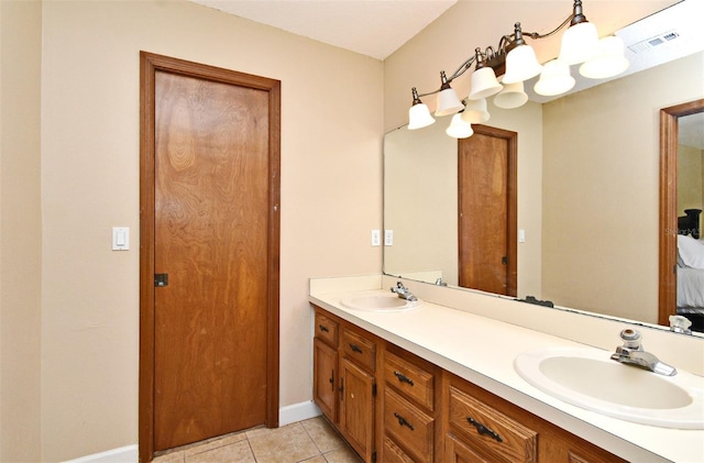 173 Tollgate Br, Longwood, FL 32750 - bathroom featuring double vanity, tile patterned flooring, and ensuite bath