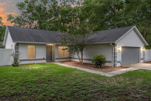 5430 NW 55th Pl, Ocala, FL 34482 - single story home with stucco siding, an attached garage, a shingled roof, and driveway