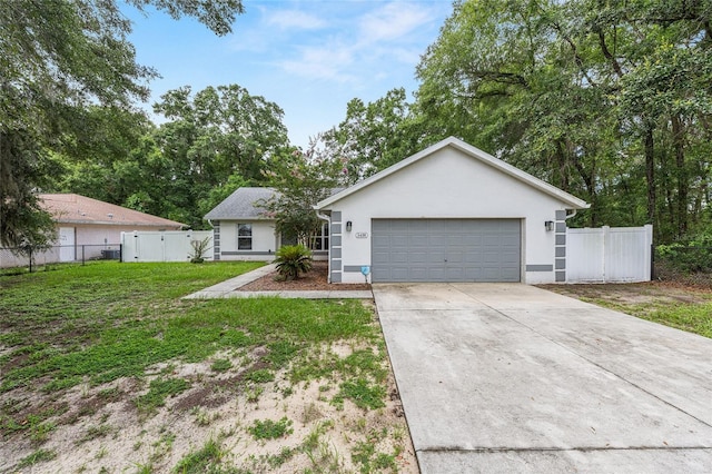 5430 NW 55th Pl, Ocala, FL 34482 - single story home featuring concrete driveway, stucco siding, and an attached garage