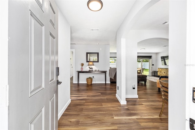 5430 NW 55th Pl, Ocala, FL 34482 - foyer entrance featuring arched walkways and wood finished floors