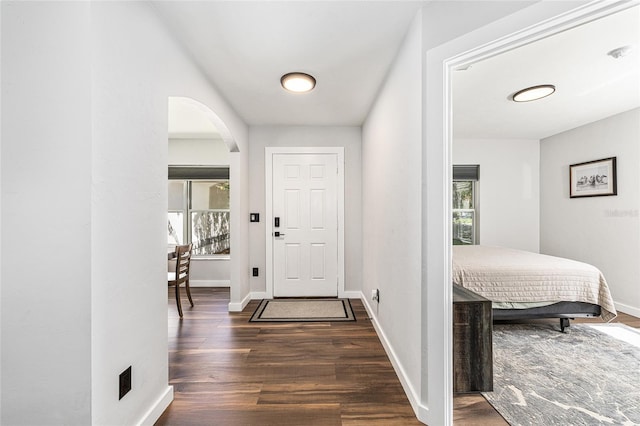 5430 NW 55th Pl, Ocala, FL 34482 - foyer with healthy amount of natural light, wood finished floors, and arched walkways