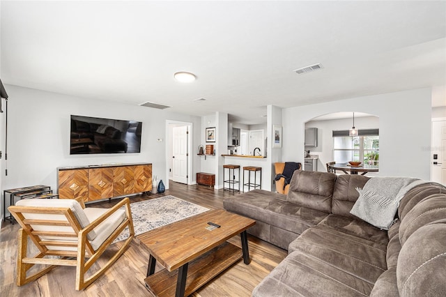 5430 NW 55th Pl, Ocala, FL 34482 - living room with arched walkways and light wood finished floors