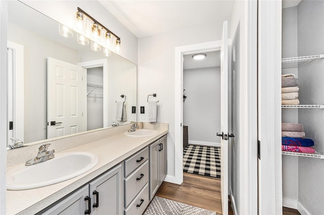 5430 NW 55th Pl, Ocala, FL 34482 - full bath with double vanity, wood finished floors, and a walk in closet