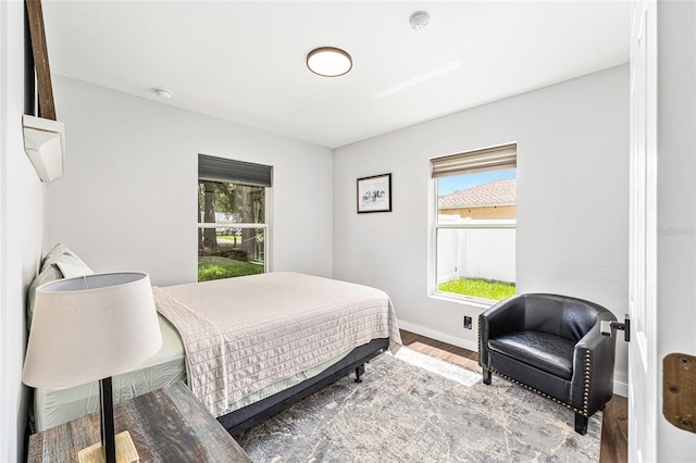 5430 NW 55th Pl, Ocala, FL 34482 - bedroom featuring wood finished floors and multiple windows