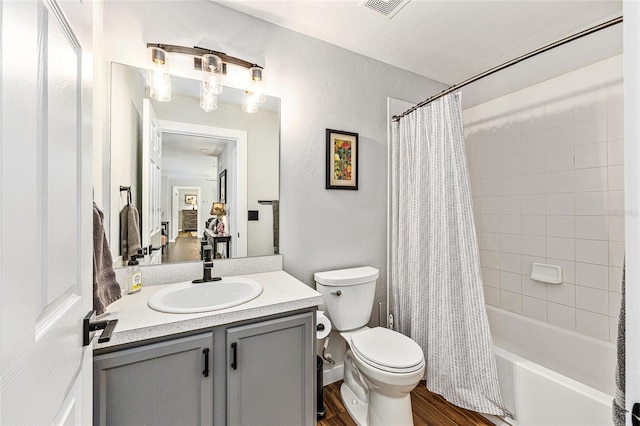 5430 NW 55th Pl, Ocala, FL 34482 - bathroom with vanity, shower / bath combo with shower curtain, and wood finished floors