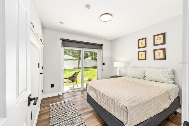 5430 NW 55th Pl, Ocala, FL 34482 - bedroom featuring access to outside and dark wood-type flooring