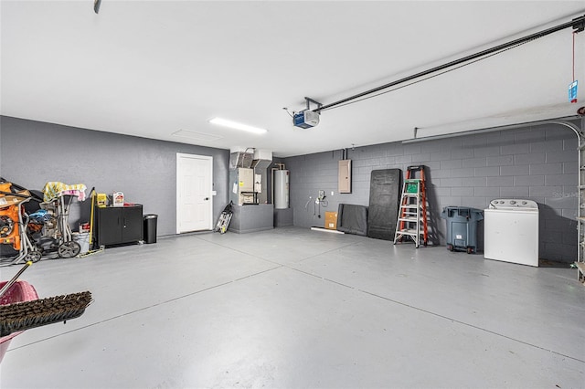 5430 NW 55th Pl, Ocala, FL 34482 - garage featuring washer / clothes dryer, a garage door opener, electric panel, water heater, and concrete block wall
