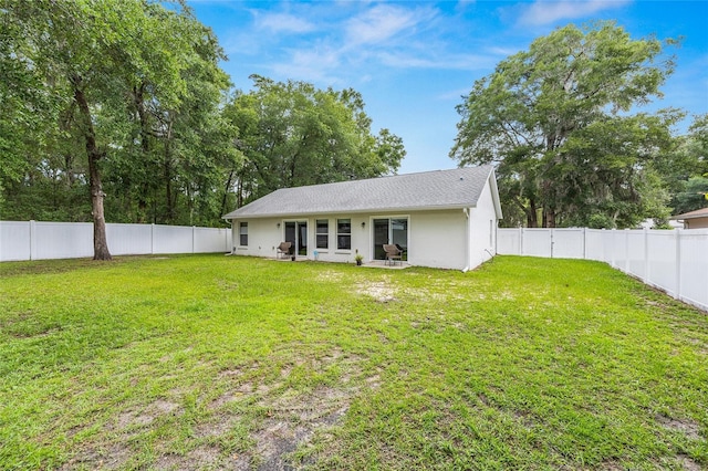 5430 NW 55th Pl, Ocala, FL 34482 - rear view of property with a fenced backyard and stucco siding