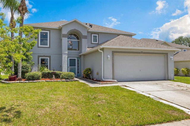 16243 Wilkinson Dr, Clermont, FL 34714 - view of front of home with stucco siding, an attached garage, concrete driveway, and a front yard