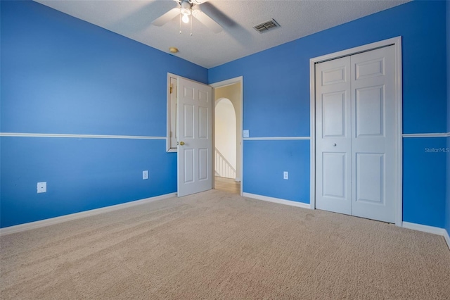 16243 Wilkinson Dr, Clermont, FL 34714 - unfurnished bedroom featuring carpet flooring, a closet, and a ceiling fan
