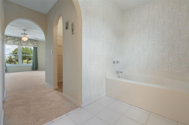 16243 Wilkinson Dr, Clermont, FL 34714 - bathroom with ceiling fan and a garden tub