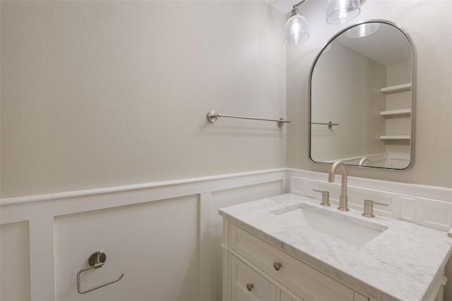16243 Wilkinson Dr, Clermont, FL 34714 - bathroom with vanity and a wainscoted wall