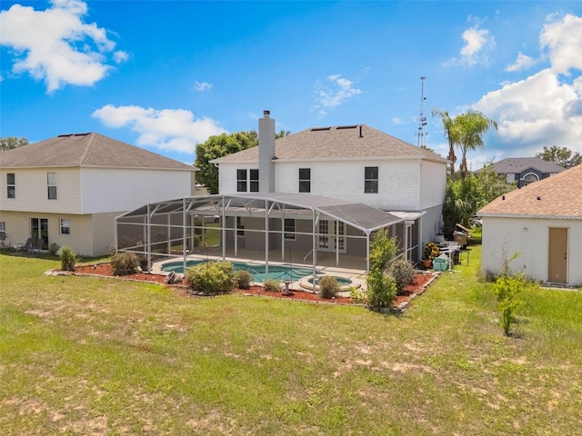 16243 Wilkinson Dr, Clermont, FL 34714 - rear view of property with a chimney, an outdoor pool, a yard, and a lanai