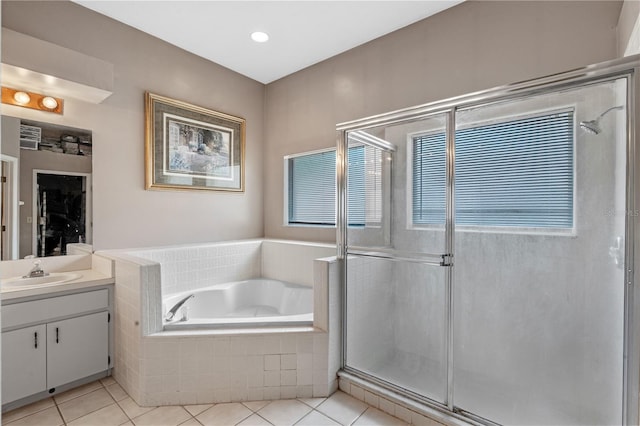1225 Hollow Pine Dr, Oviedo, FL 32765 - bathroom featuring vanity, tile patterned flooring, a bath, and a stall shower
