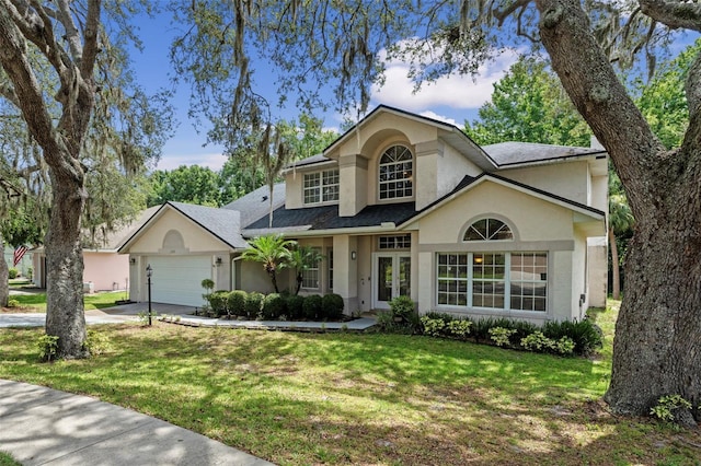 1225 Hollow Pine Dr, Oviedo, FL 32765 - traditional home featuring stucco siding, an attached garage, a front lawn, and concrete driveway