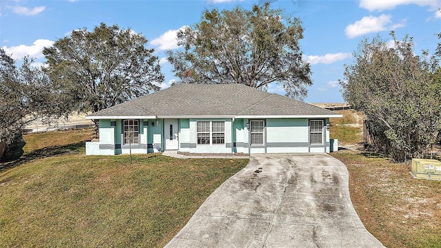 12419 Eryn Ct, Clermont, FL 34711 - single story home with driveway, a front lawn, and stucco siding
