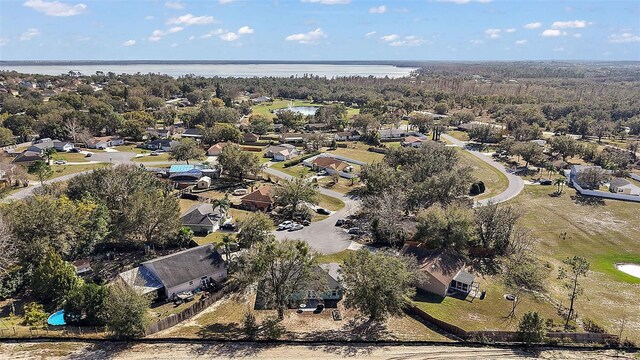 12419 Eryn Ct, Clermont, FL 34711 - aerial perspective of suburban area with a nearby body of water