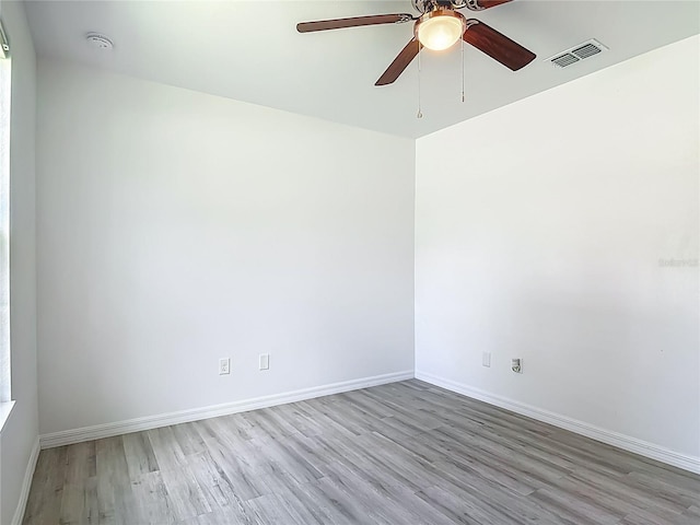 1816 Alexander Ave, Sanford, FL 32771 - spare room with wood finished floors, ceiling fan, and a smoke detector